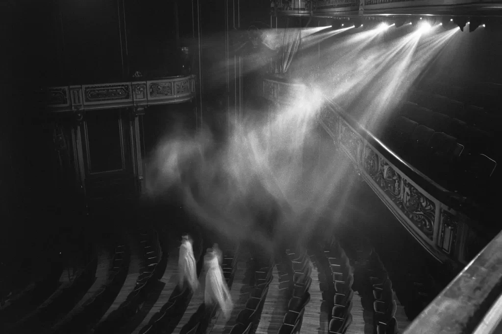 Spirits walking in a theater