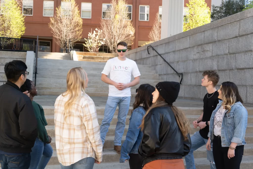 A tour group standing on a set of stairs