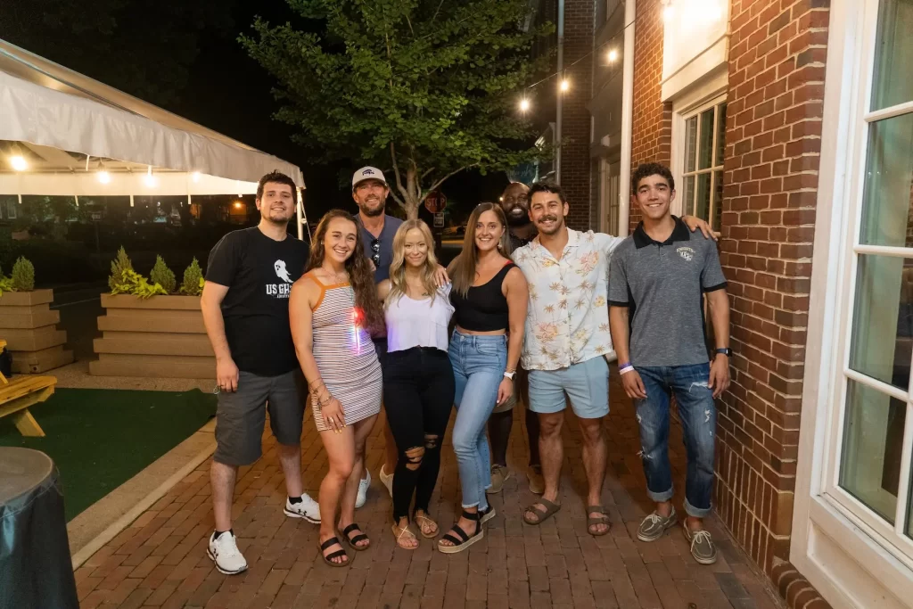 A group next to a red brick building