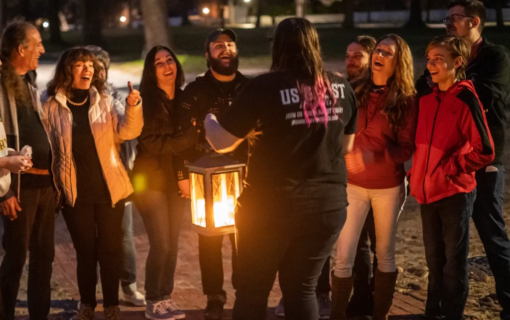 Guide Outside Lantern Night with Group Laughing