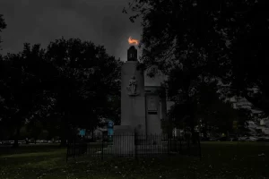 A monument with a torch in the middle