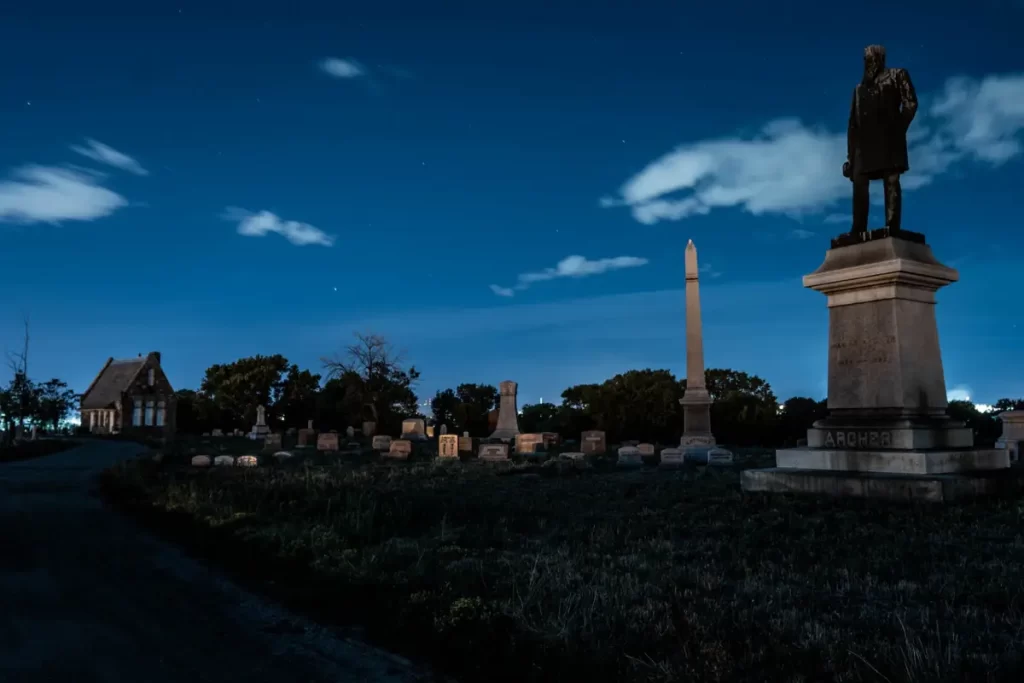 A statue amongst tombstones