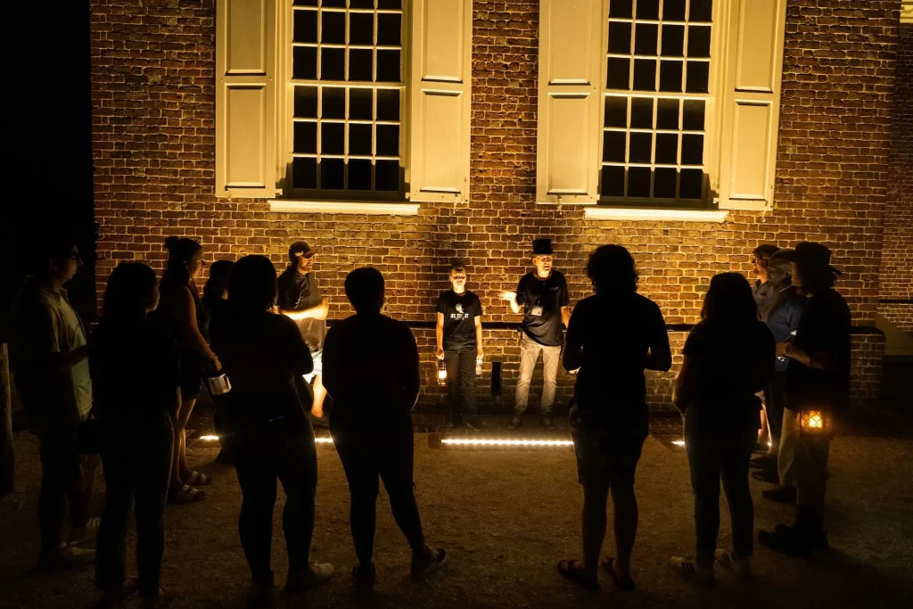 Group Ghost Tour Shadows Old Building